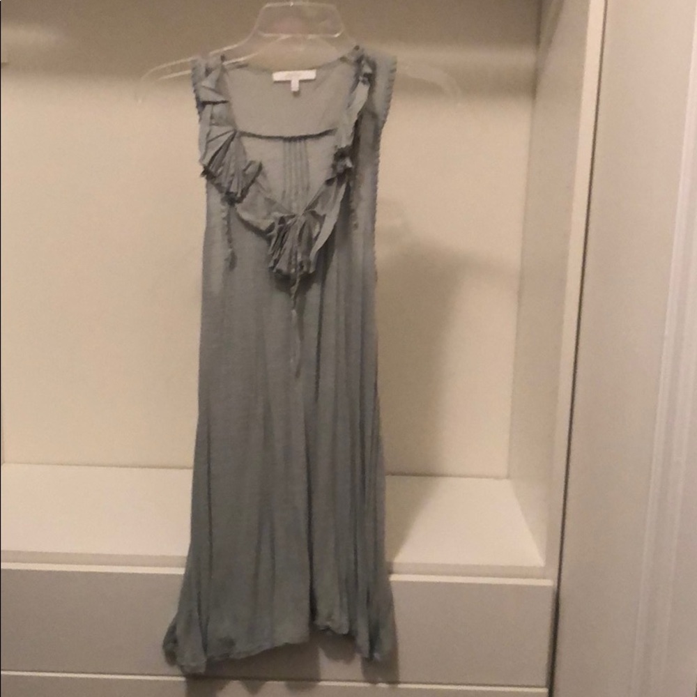 Mystree sleeveless blouse with ragged neck.